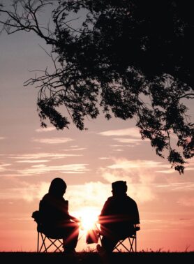 Couple at sunset retirement planning