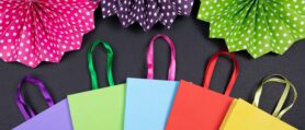 Colorful shopping bags and folded tissue paper
