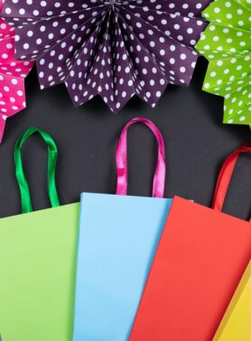 Colorful shopping bags and folded tissue paper